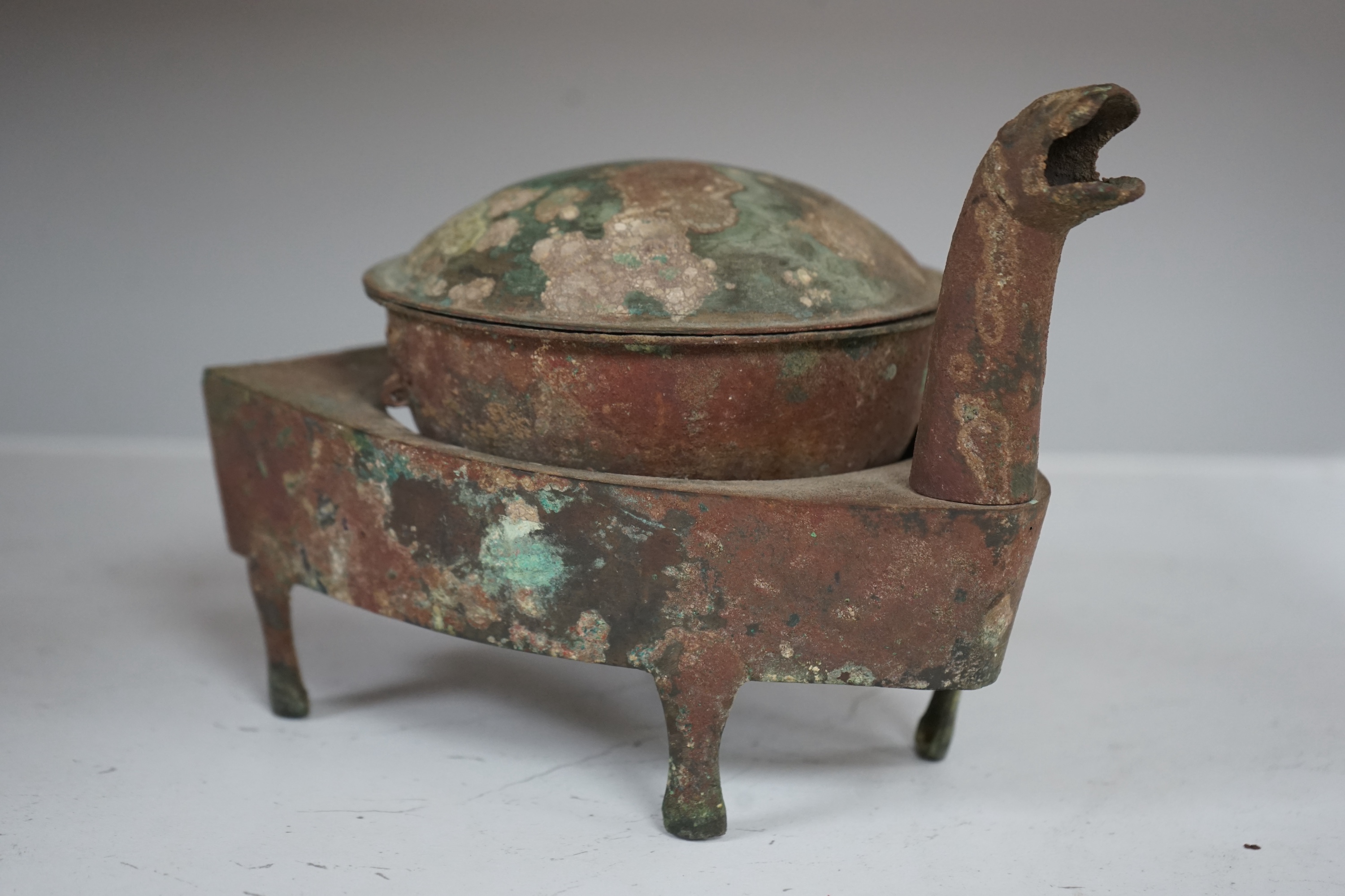 A Chinese bronze zoomorphic stove, Han Dynasty, 21cm long. Condition - fair